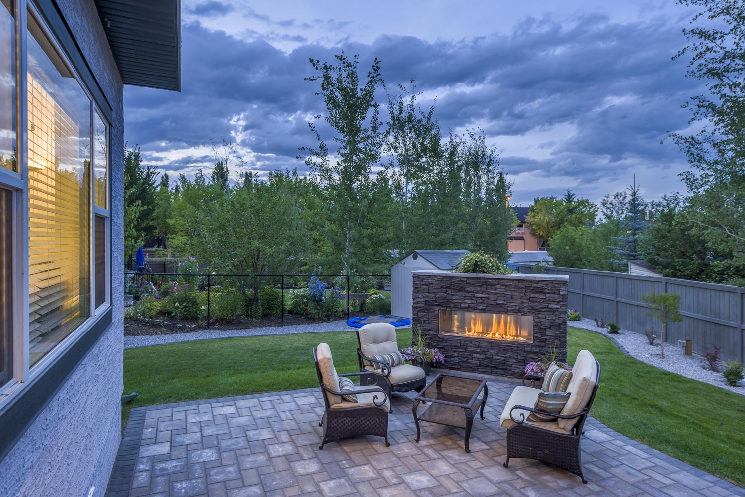 Fire Place At Night | Oasis Landscaping